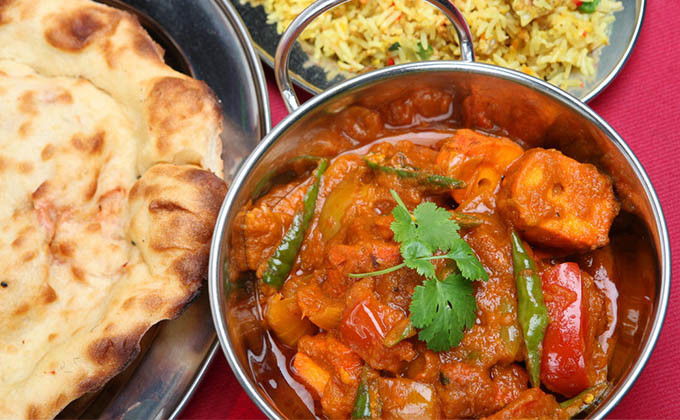 A karahi curry served with fresh tandoor-baked naan